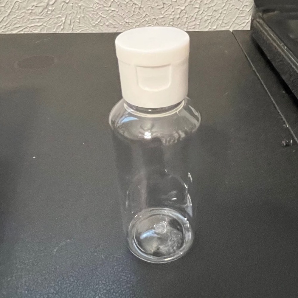 18 Pack 2oz Clear Plastic Travel Bottles with Flip Top Caps and 2 Funnels